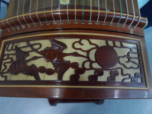 The carving detail on the guzheng